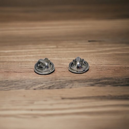 Pair of caps for pin attachment